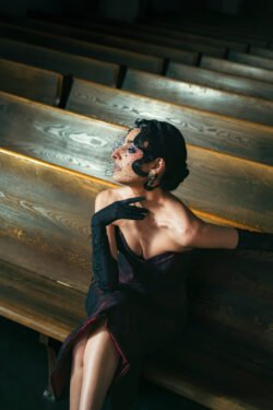 Editorial Photography - model on a wooden bench in a cathedral. Creative direction by Karyn Rudance, Photography by Yvonne Hanson