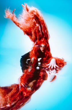 Editorial red hair, Mugler-inspired alternative fashion. Creative Direction: Karyn Rudance. Photography: Yvonne Hanson.